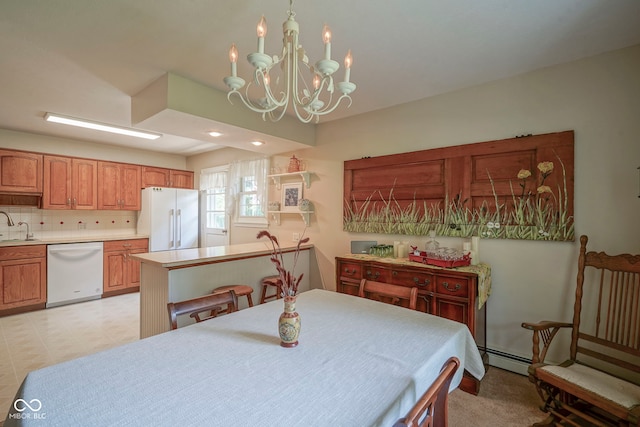 1524 Northcrest Dr, Anderson, IN 46012 - dining area featuring a chandelier, a baseboard radiator, and recessed lighting