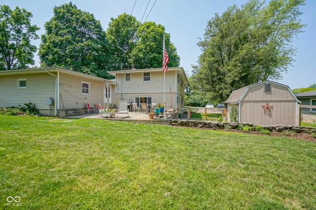1524 Northcrest Dr, Anderson, IN 46012 - rear view of property featuring a patio area, a storage shed, and a yard
