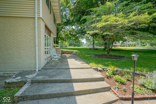 1524 Northcrest Dr, Anderson, IN 46012 - view of green lawn featuring a patio