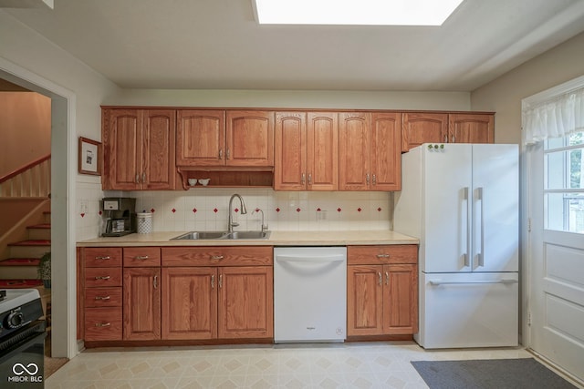 1524 Northcrest Dr, Anderson, IN 46012 - kitchen featuring white appliances, brown cabinets, and light countertops