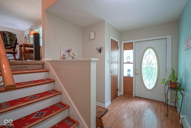 1524 Northcrest Dr, Anderson, IN 46012 - entryway featuring wood finished floors and a baseboard radiator