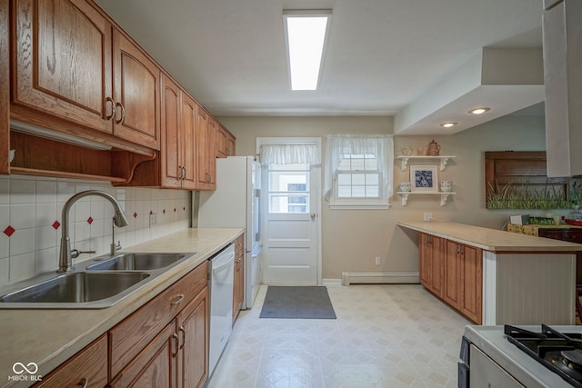 1524 Northcrest Dr, Anderson, IN 46012 - kitchen featuring white appliances, light flooring, a peninsula, light countertops, and recessed lighting