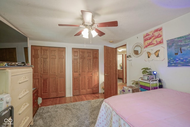 1524 Northcrest Dr, Anderson, IN 46012 - bedroom featuring two closets, wood finished floors, and ceiling fan