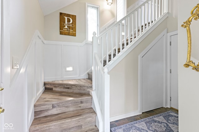 17320 Joliet Rd, Westfield, IN 46074 - foyer with a decorative wall, stairway, a wainscoted wall, and vaulted ceiling