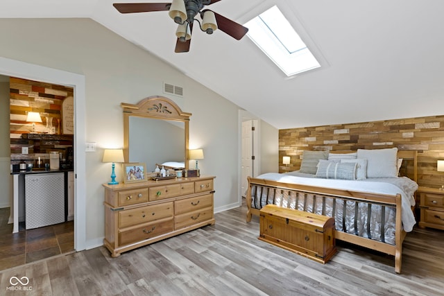 17320 Joliet Rd, Westfield, IN 46074 - bedroom with vaulted ceiling, a skylight, wood finished floors, and a ceiling fan