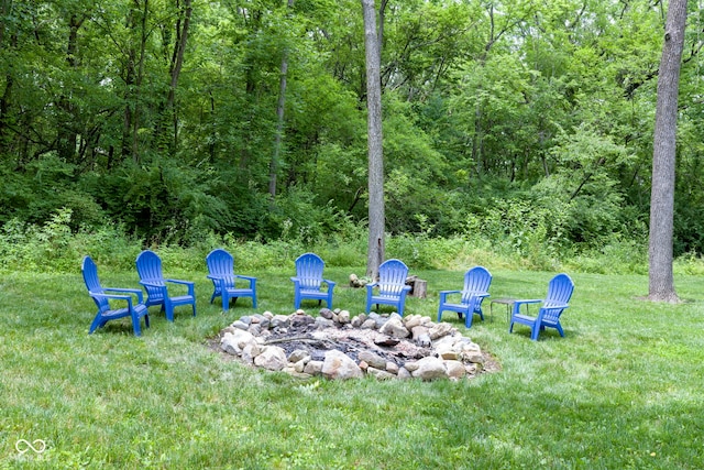 17320 Joliet Rd, Westfield, IN 46074 - view of green lawn featuring an outdoor fire pit and a forest view