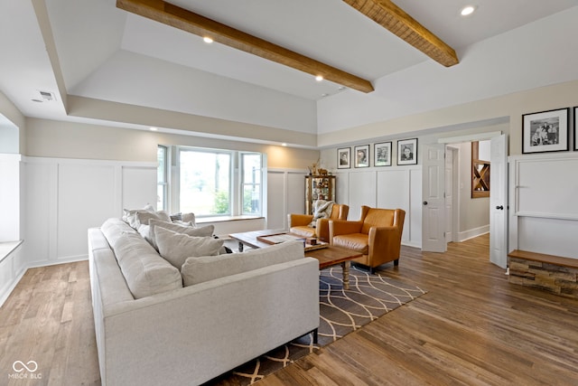 17320 Joliet Rd, Westfield, IN 46074 - living area featuring a decorative wall, wood finished floors, beam ceiling, and a wainscoted wall