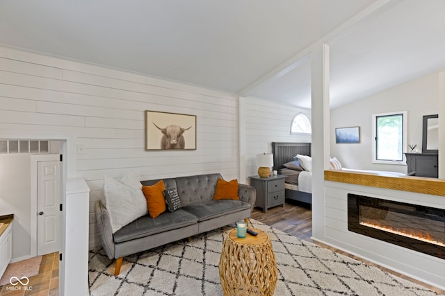 17320 Joliet Rd, Westfield, IN 46074 - living area with light wood-style flooring, wood walls, and lofted ceiling
