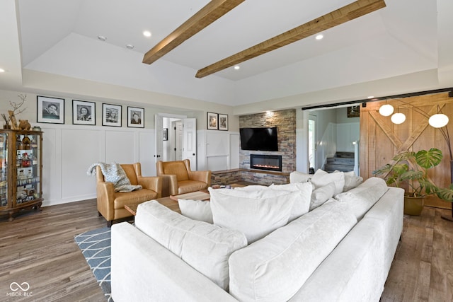 17320 Joliet Rd, Westfield, IN 46074 - living area featuring wood finished floors, a fireplace, a decorative wall, recessed lighting, and beam ceiling