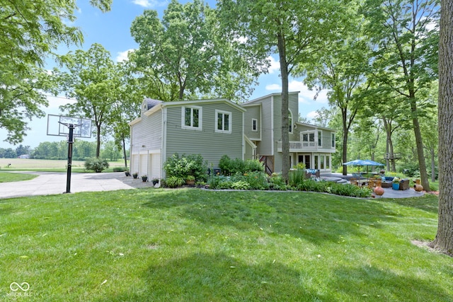 17320 Joliet Rd, Westfield, IN 46074 - view of front of house with a garage, a front yard, concrete driveway, and a balcony