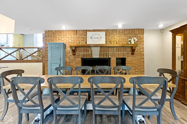 17320 Joliet Rd, Westfield, IN 46074 - dining space featuring a fireplace and light wood-style floors