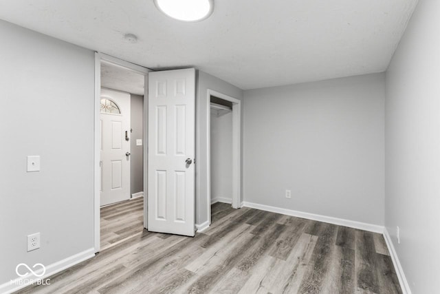 3529 Hunt St, Plainfield, IN 46168 - unfurnished bedroom with wood finished floors and a closet