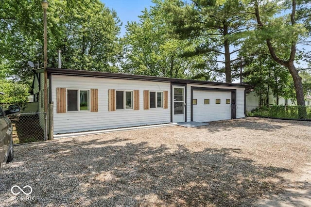 3529 Hunt St, Plainfield, IN 46168 - view of front of property with an attached garage and dirt driveway