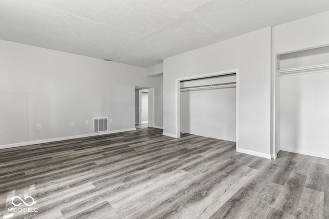 3529 Hunt St, Plainfield, IN 46168 - unfurnished bedroom featuring wood finished floors and a textured ceiling