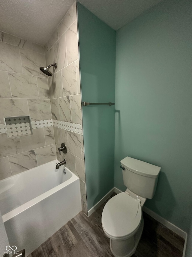 4715 Normal Ave, Indianapolis, IN 46226 - bathroom with a textured ceiling, washtub / shower combination, and wood finished floors