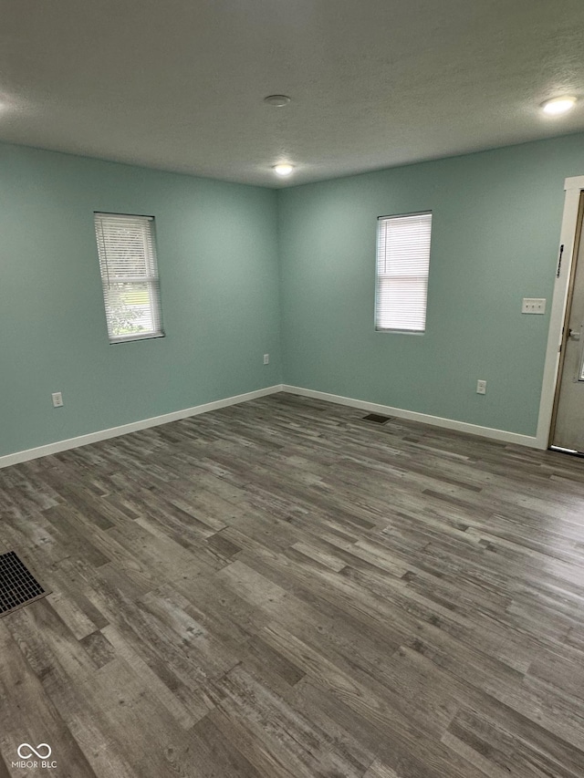 4715 Normal Ave, Indianapolis, IN 46226 - empty room featuring dark wood-style floors