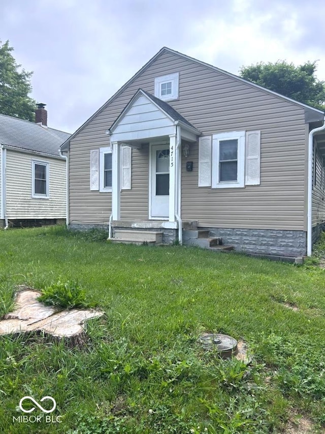 4715 Normal Ave, Indianapolis, IN 46226 - bungalow-style home featuring a front lawn