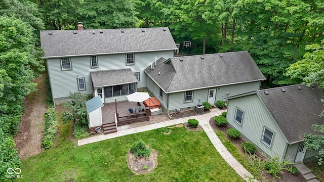 10808 Greenbriar Dr, Fishers, IN 46037 - rear view of house with a sunroom, a deck, a chimney, and a yard