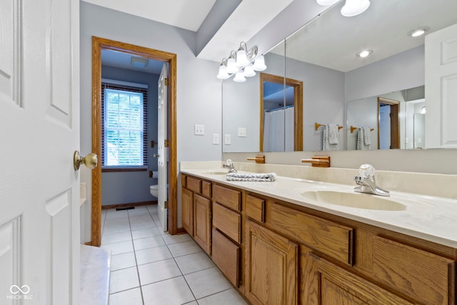 10808 Greenbriar Dr, Fishers, IN 46037 - full bathroom with double vanity and tile patterned floors
