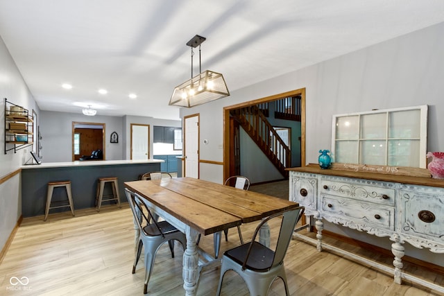 10808 Greenbriar Dr, Fishers, IN 46037 - dining space with light wood finished floors, recessed lighting, and stairway