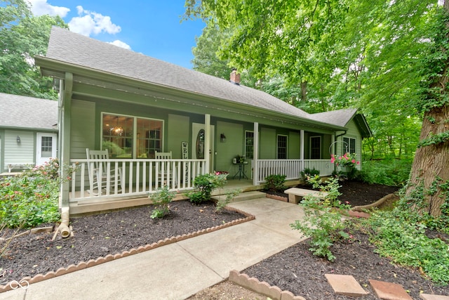10808 Greenbriar Dr, Fishers, IN 46037 - ranch-style house featuring covered porch, a chimney, and a shingled roof