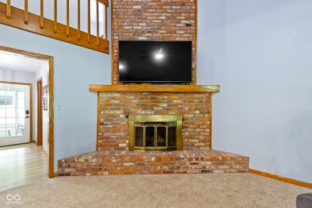10808 Greenbriar Dr, Fishers, IN 46037 - unfurnished living room with a brick fireplace and carpet