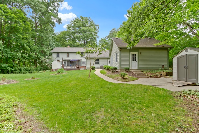 10808 Greenbriar Dr, Fishers, IN 46037 - view of grassy yard featuring a storage shed and a deck