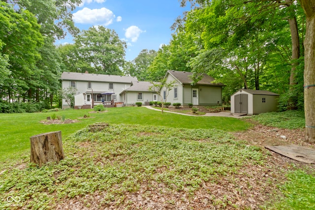 10808 Greenbriar Dr, Fishers, IN 46037 - view of grassy yard featuring a storage unit and a wooden deck