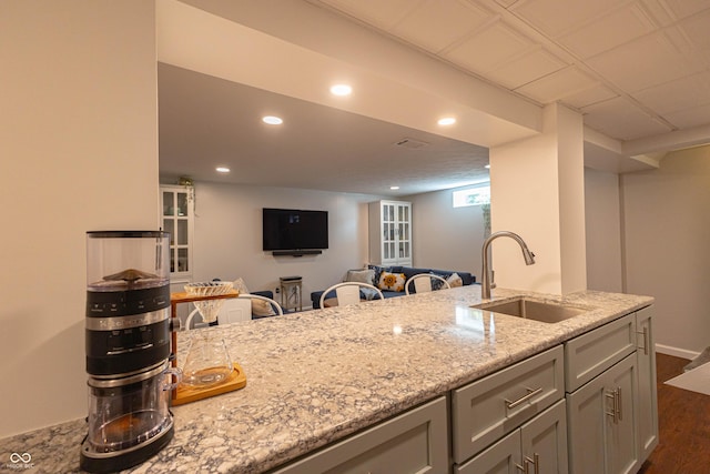 5609 Meadowood Dr, Indianapolis, IN 46224 - kitchen with dark wood-type flooring, light stone countertops, recessed lighting, and open floor plan