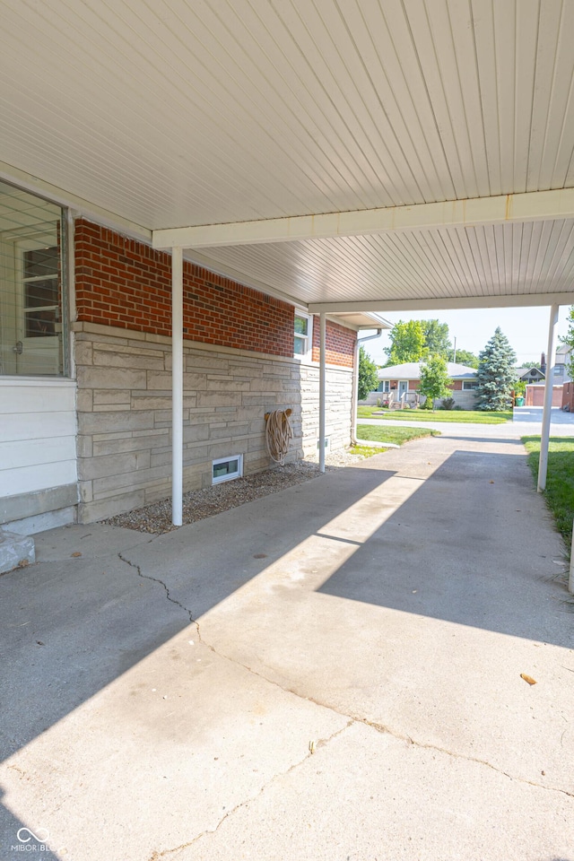 5609 Meadowood Dr, Indianapolis, IN 46224 - view of patio / terrace featuring a carport