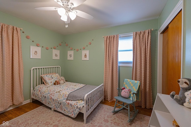 5609 Meadowood Dr, Indianapolis, IN 46224 - bedroom with wood finished floors, ceiling fan, and a closet