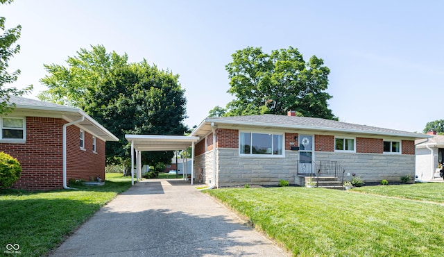 5609 Meadowood Dr, Indianapolis, IN 46224 - view of front facade with stone siding, concrete driveway, a carport, and a front lawn