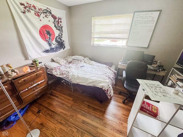 3613 N Locust St, Muncie, IN 47304 - bedroom featuring wood finished floors and a desk