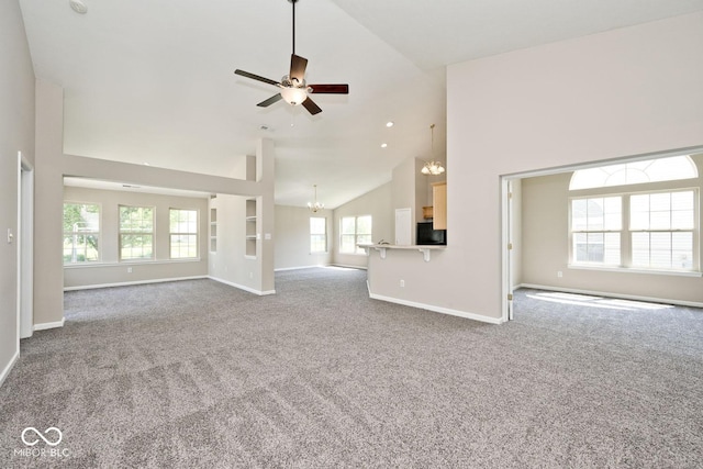 10668 Whippoorwill Ln, Indianapolis, IN 46231 - unfurnished living room with a chandelier, high vaulted ceiling, carpet, and ceiling fan