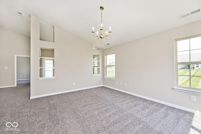 10668 Whippoorwill Ln, Indianapolis, IN 46231 - spare room featuring a chandelier, carpet flooring, plenty of natural light, and lofted ceiling