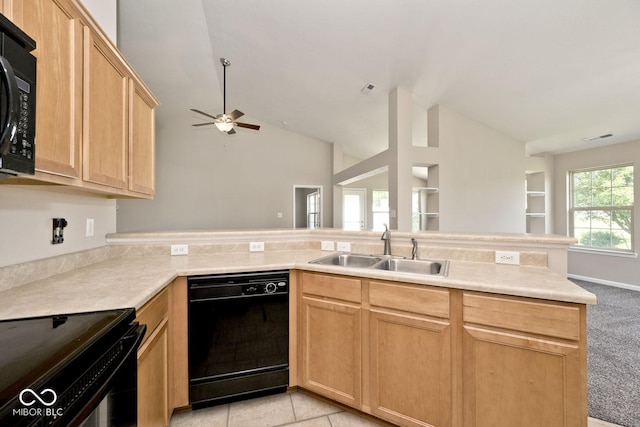 10668 Whippoorwill Ln, Indianapolis, IN 46231 - kitchen featuring black appliances, light brown cabinets, vaulted ceiling, light countertops, and a ceiling fan