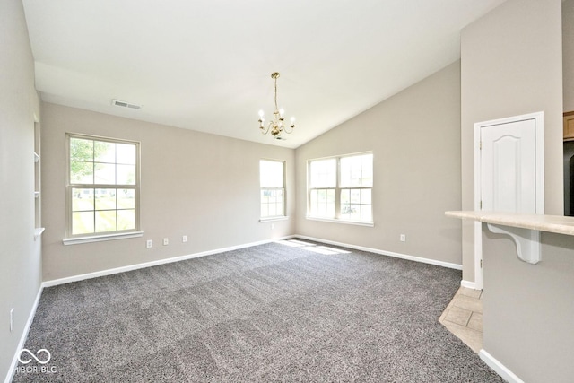 10668 Whippoorwill Ln, Indianapolis, IN 46231 - carpeted spare room featuring a chandelier and lofted ceiling