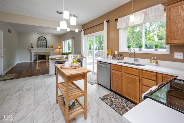 14492 Cotswold Ln, Carmel, IN 46033 - kitchen with dishwasher, black range with electric cooktop, hanging light fixtures, light countertops, and open floor plan