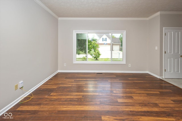 14492 Cotswold Ln, Carmel, IN 46033 - empty room with dark wood finished floors, a textured ceiling, and ornamental molding