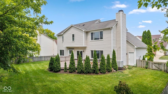 14492 Cotswold Ln, Carmel, IN 46033 - rear view of house with a chimney, a fenced backyard, and roof with shingles
