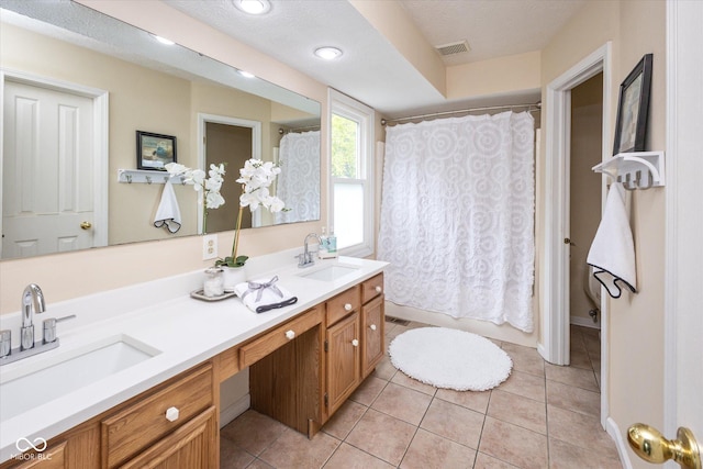 14492 Cotswold Ln, Carmel, IN 46033 - full bathroom with double vanity, tile patterned floors, and shower / bath combination with curtain