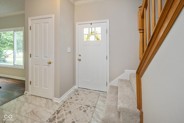 14492 Cotswold Ln, Carmel, IN 46033 - foyer featuring ornamental molding, stairs, and light marble finish floors