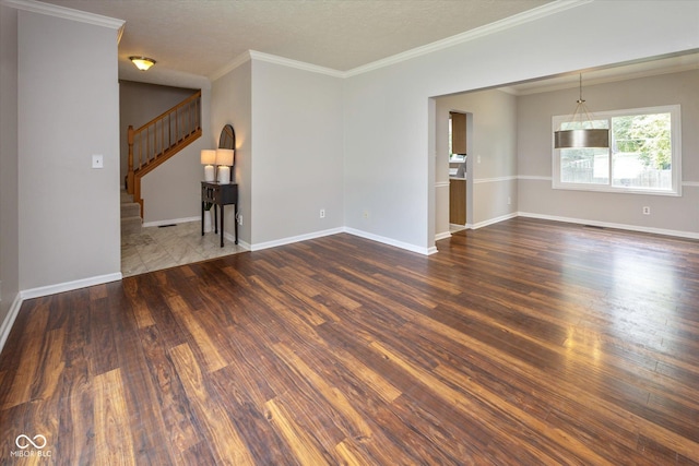 14492 Cotswold Ln, Carmel, IN 46033 - empty room with dark wood-style floors, stairway, ornamental molding, and a textured ceiling