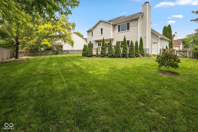 14492 Cotswold Ln, Carmel, IN 46033 - back of house featuring a fenced backyard and a chimney