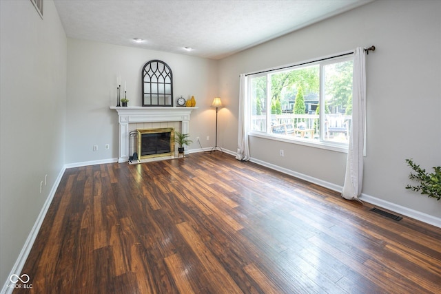 14492 Cotswold Ln, Carmel, IN 46033 - unfurnished living room with a tile fireplace and wood finished floors
