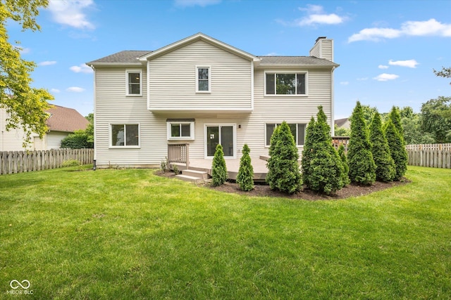 14492 Cotswold Ln, Carmel, IN 46033 - rear view of house with a chimney, a fenced backyard, and a deck