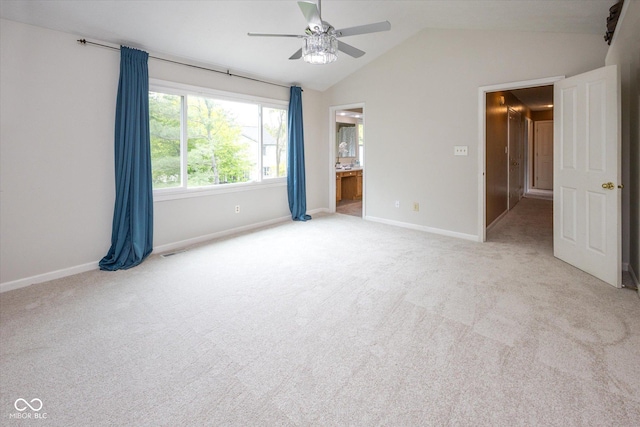 14492 Cotswold Ln, Carmel, IN 46033 - unfurnished bedroom with vaulted ceiling, light carpet, ensuite bathroom, and a ceiling fan