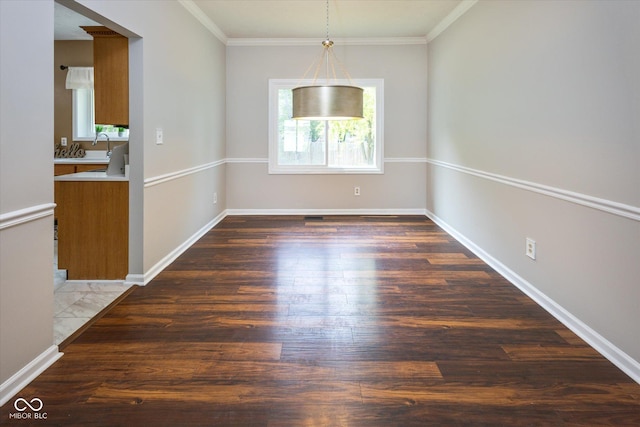 14492 Cotswold Ln, Carmel, IN 46033 - unfurnished dining area with plenty of natural light, wood finished floors, and crown molding