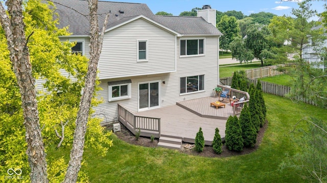 14492 Cotswold Ln, Carmel, IN 46033 - rear view of house featuring a deck, a chimney, and roof with shingles