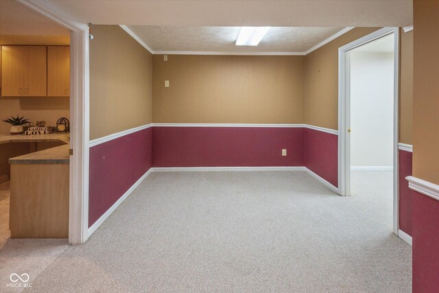 14492 Cotswold Ln, Carmel, IN 46033 - finished below grade area with carpet floors, crown molding, and a textured ceiling